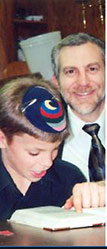 Rabbi Stuart Lavenda learning with one of his sons